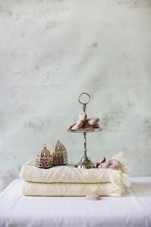 Gingerbread Hearts On Cakes Stand And Oriental Lanterns On Folded Blanket Photograph by Alicja Koll