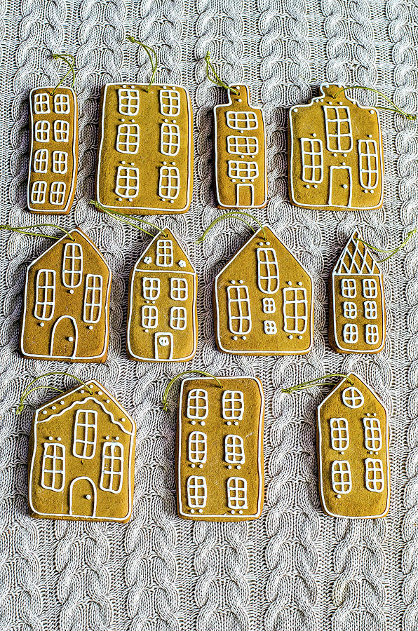 Gingerbread Houses With Golden Ropes To Decorate The Christmas Tree On A Knitted Surface Photograph by Gorobina