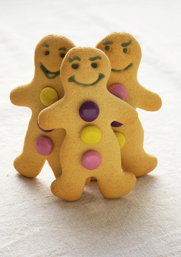 Gingerbread Men Decorated With Colourful Chocolate Beans Photograph by Joy Skipper Foodstyling