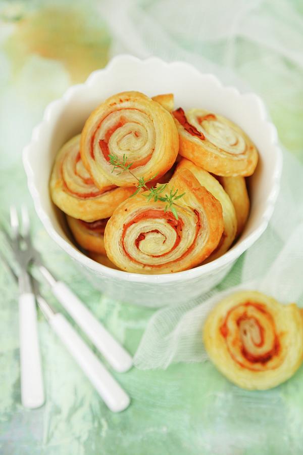 Girelle puff Pastry Swirls With Ham And Cheese Photograph by Claudia Gargioni