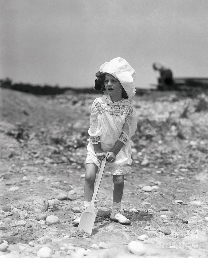 Girl 6-7 Years With Shovel Photograph by Bettmann