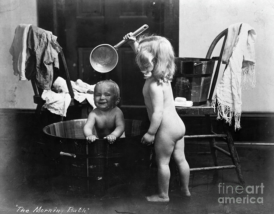 Girl Bathing Her Brother Photograph by Bettmann
