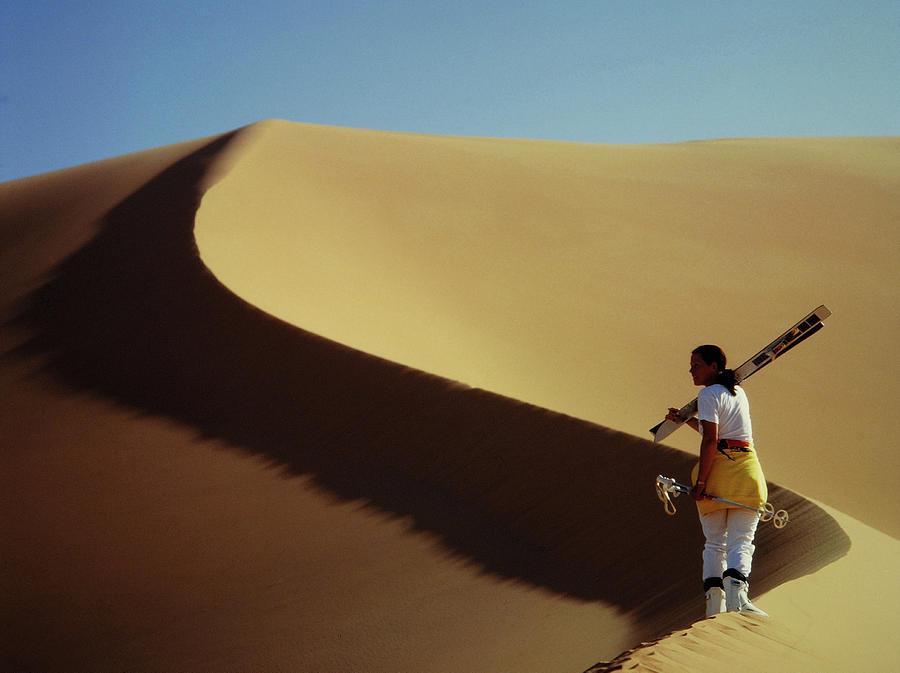 Girl Climbing On A Sand Dune For Skiing By Friedrich Schmidt