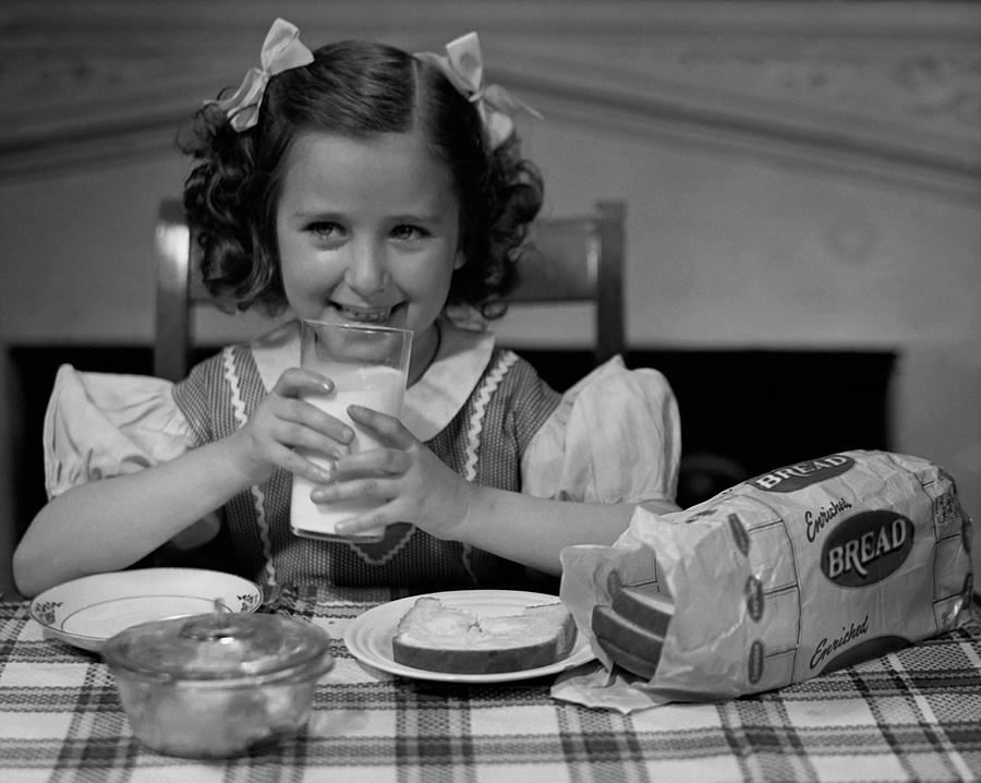 Girl Drinking A Glass Of Milk Photograph by George Marks