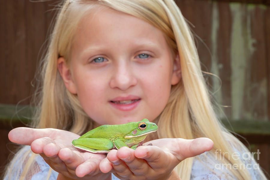Girl Holding Frog Photograph by Conceptual Images/science Photo Library