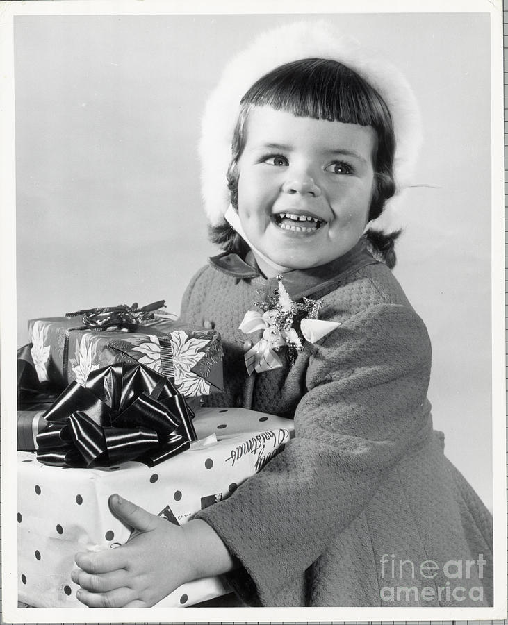 Girl Holding Gifts Photograph by Bettmann