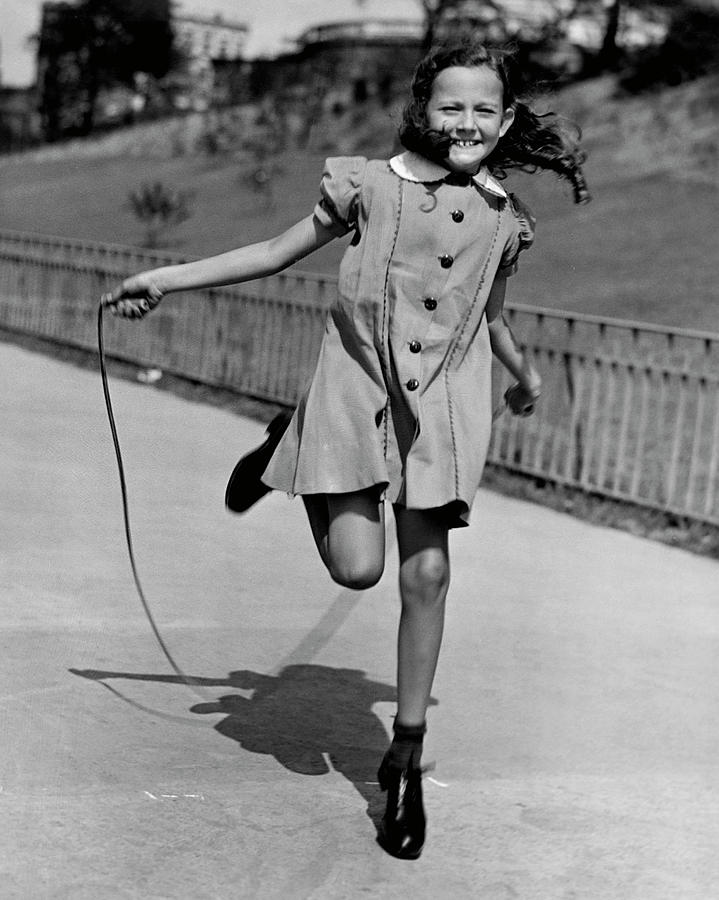 Girl Jumping Rope Photograph by George Marks