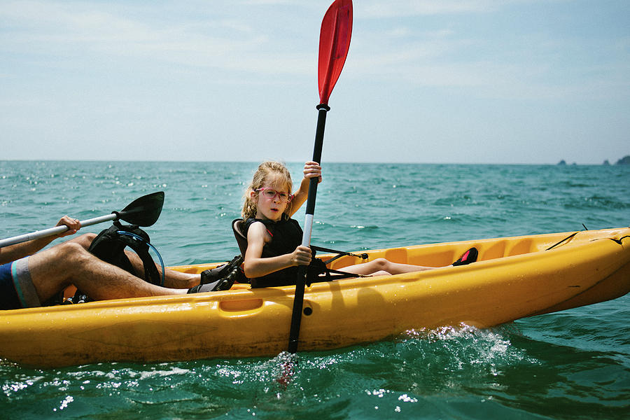 Girl Kayaks With Her Dad On Ocean In Summer Heat Photograph By Cavan 