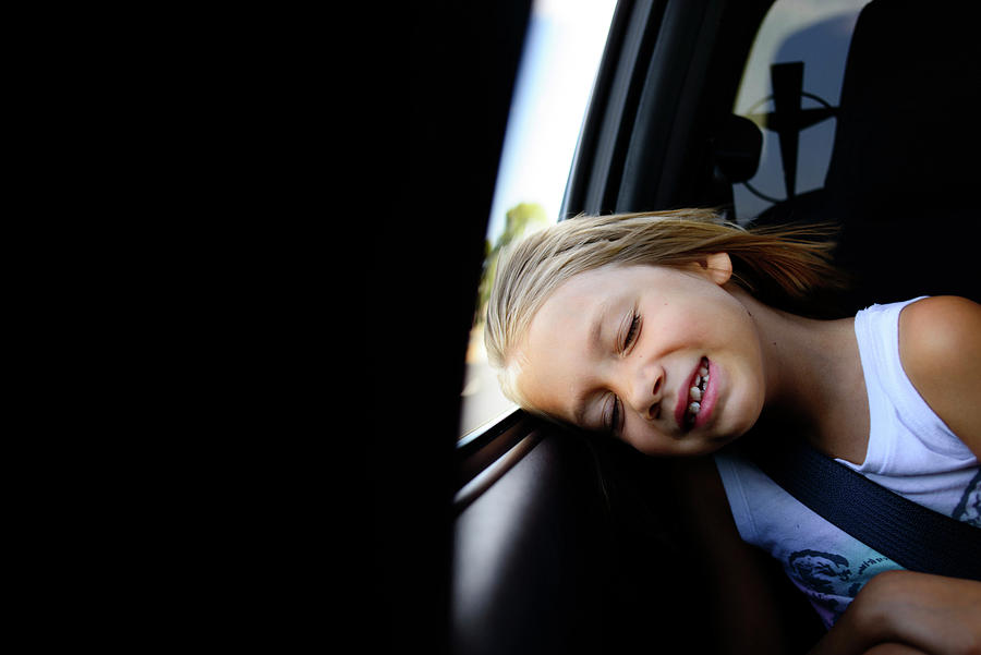 Transportation Photograph - Girl Napping While Sitting In Car by Cavan Images
