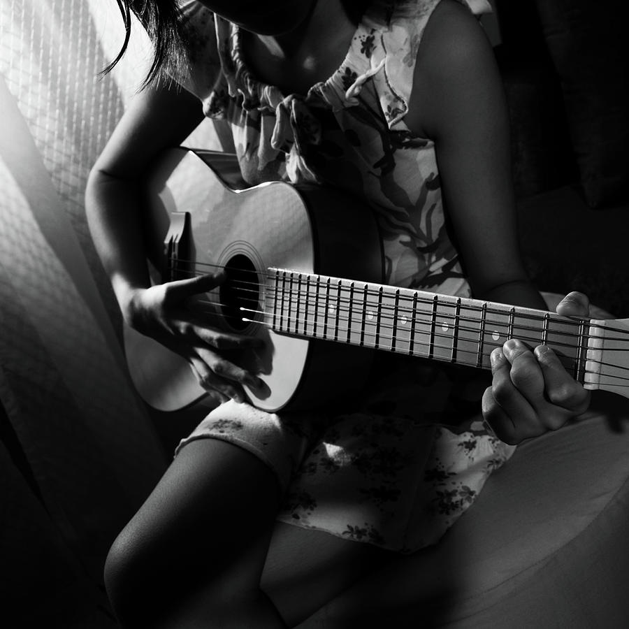 Girl Playing Guitar By Ricky Paras