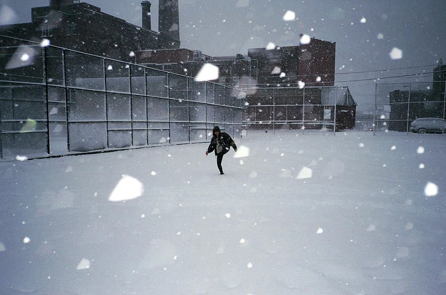 Girl Playing In Snowstorm Photograph by Levi Mandel