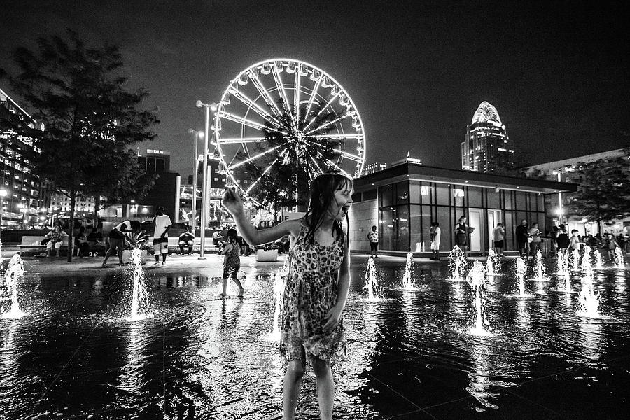 Girl Playing in the Fountain Photograph by Anthony Doudt