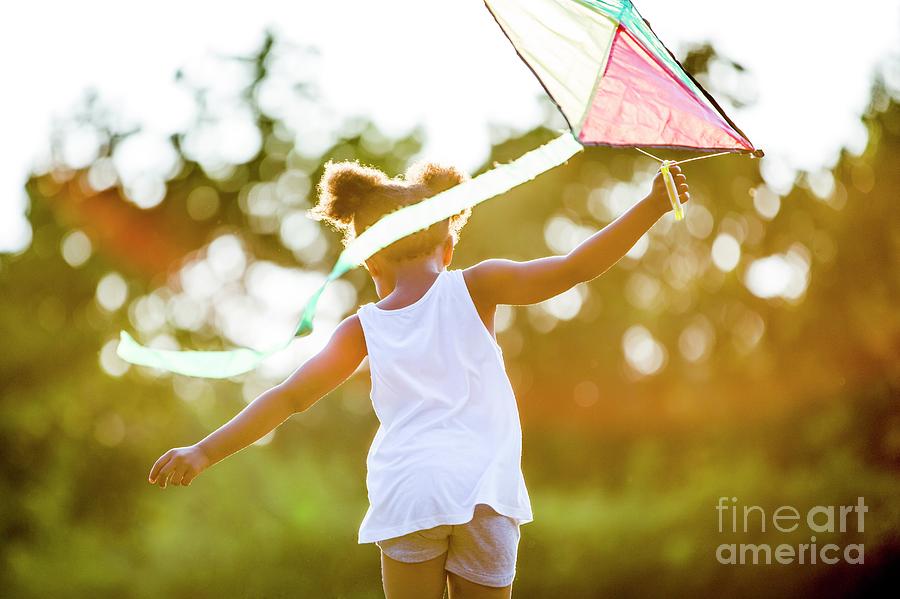 Girl Playing With Kite Photograph by Science Photo Library