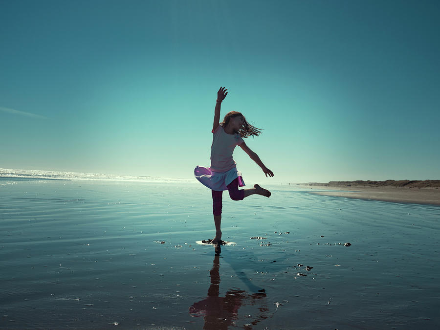 Girl Plays At Beach Photograph by Donald Iain Smith