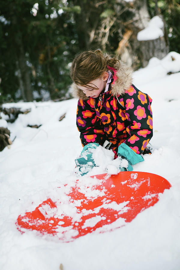 Winter Photograph - Girl Plays With Snow And Sled In Snowy Forest And Winter Scene by Cavan Images / Anna Rasmussen Photographs