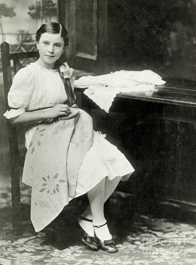 Girl Sewing Photograph by Bettmann