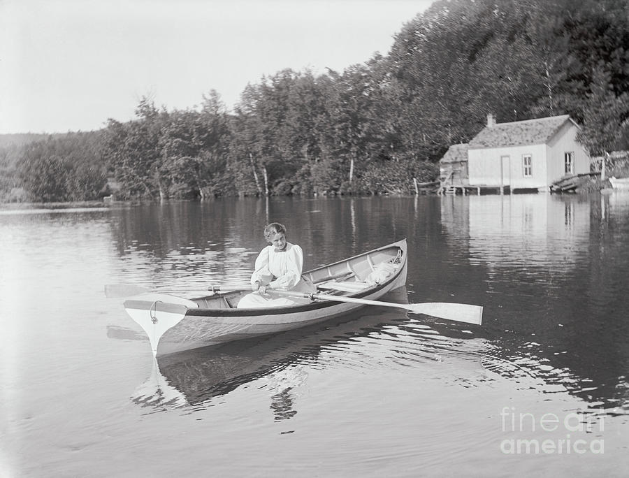 Girl Sitting In Rowboat Photograph by Bettmann