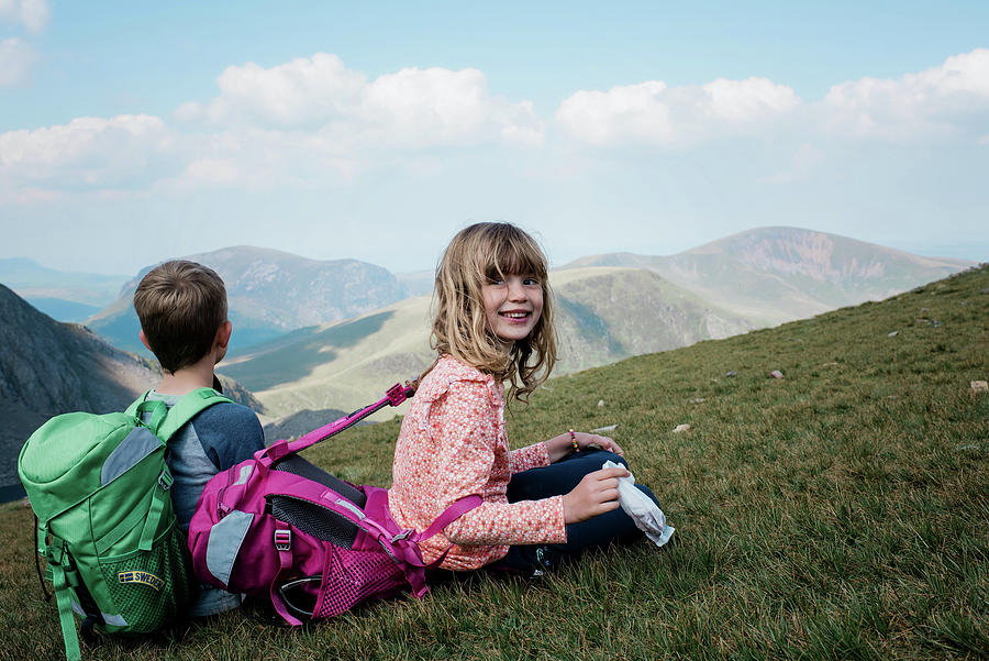 Girl Smiling At The Top Of A Mountain On A Hiking Trip In Wales ...