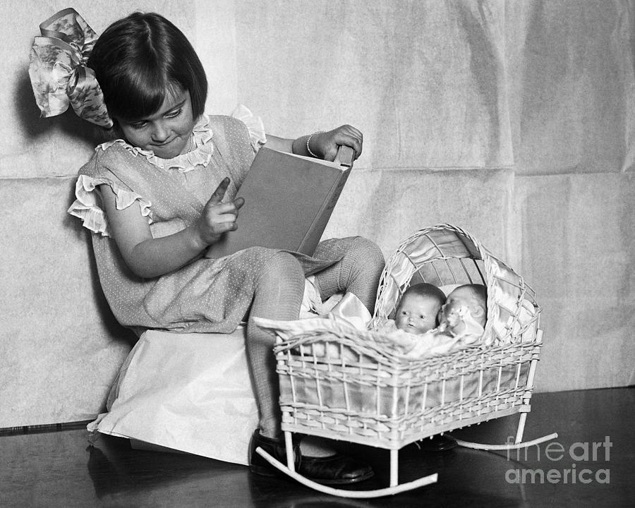 Girl Telling Dollies A Bedtime Story Photograph by Bettmann