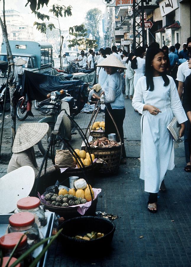 Girl Walking By The Market In Saigon Photograph by Keystone-france