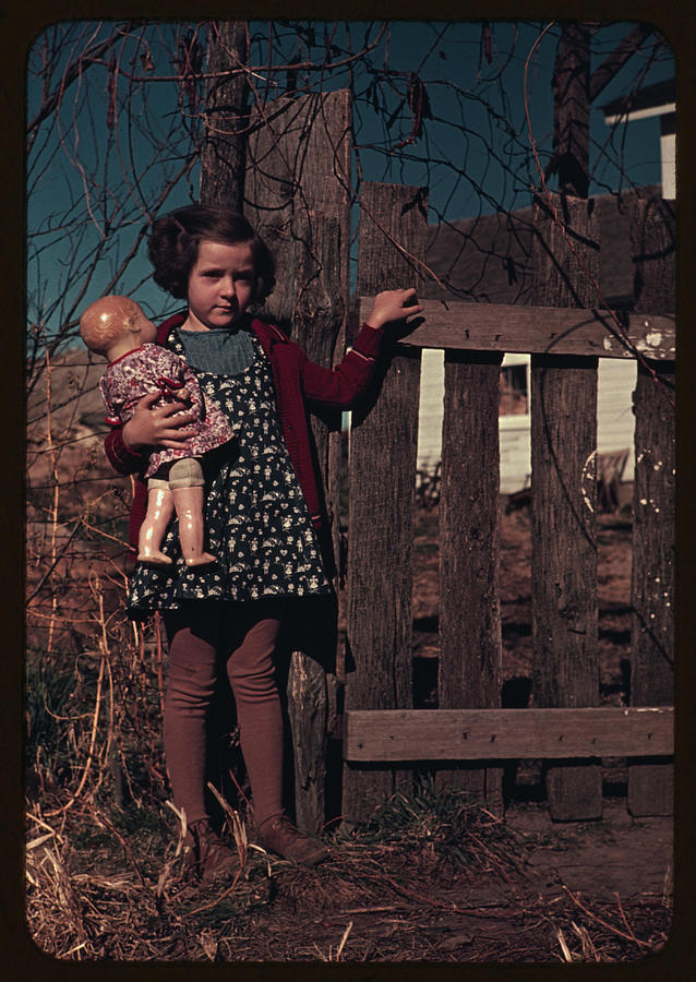 Girl with doll standing by fence Painting by 