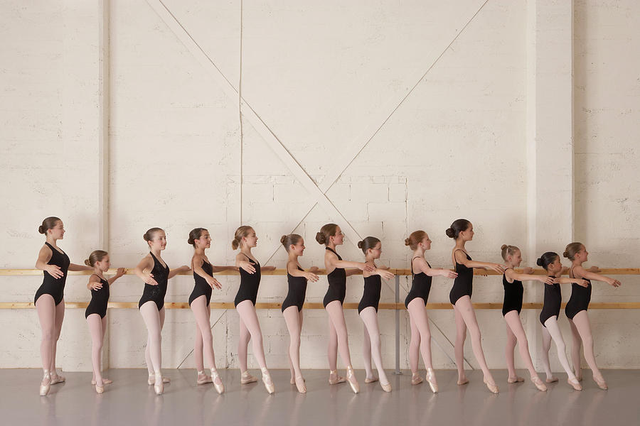 Girls 8-13 In Ballet Class, Holding Bar Photograph by David Fischer