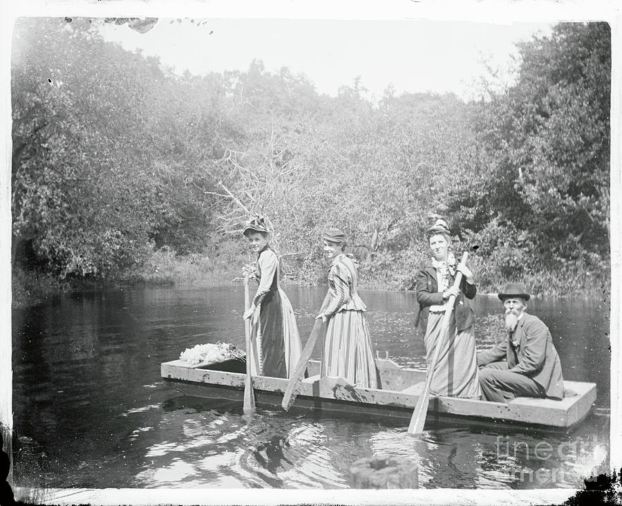 Girls And Man In Flat Rowboat Photograph by Bettmann