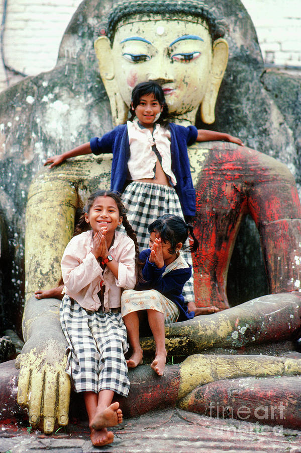 Girls Having Fun On A Statue Of Buddha In Kathmandu Nepal Photograph By Wernher Krutein Fine