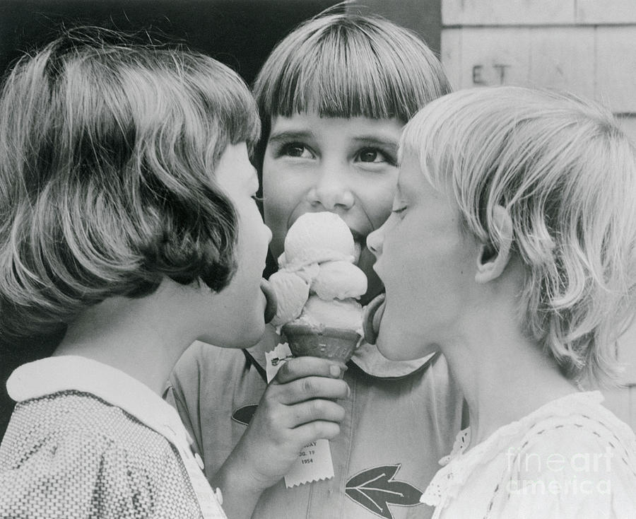 Girls Licking Ice Cream By Bettmann