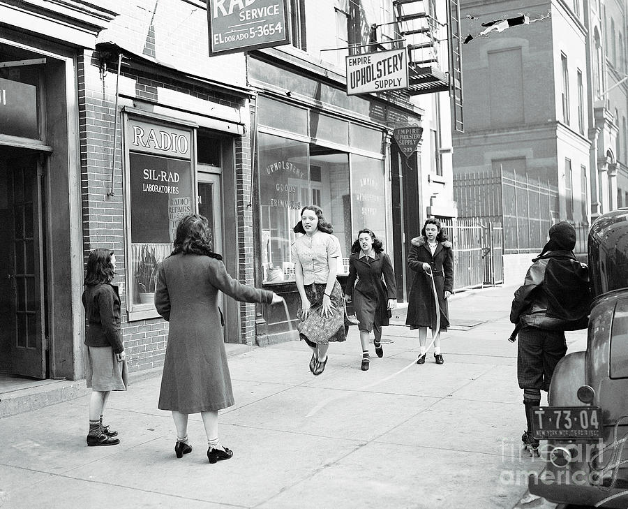 Girls Skipping Rope On Sidewalk Photograph by Bettmann