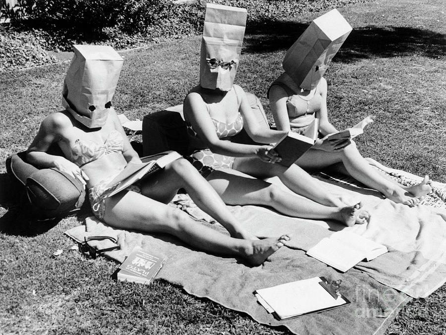 Girls Sunbathing With Paper Bags Photograph by Bettmann