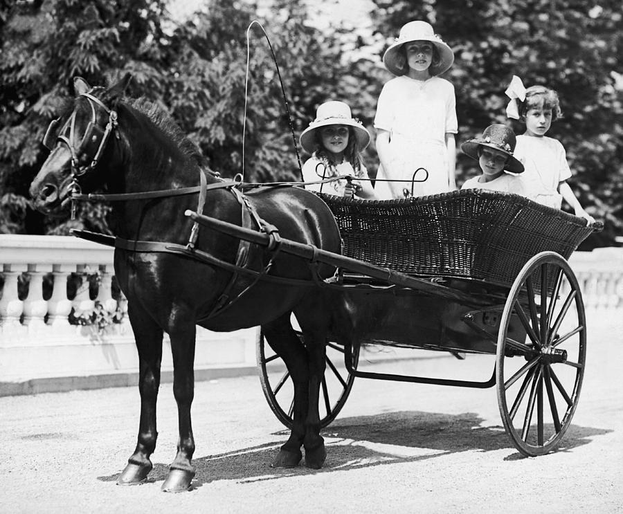 Girls Travelling In Horse Drawn Photograph by Fpg