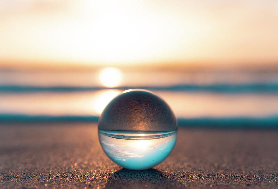 Glass Ball On Ocean Seashore Beach Relaxing Mediation Yoga Zen Concept by  Cavan Images