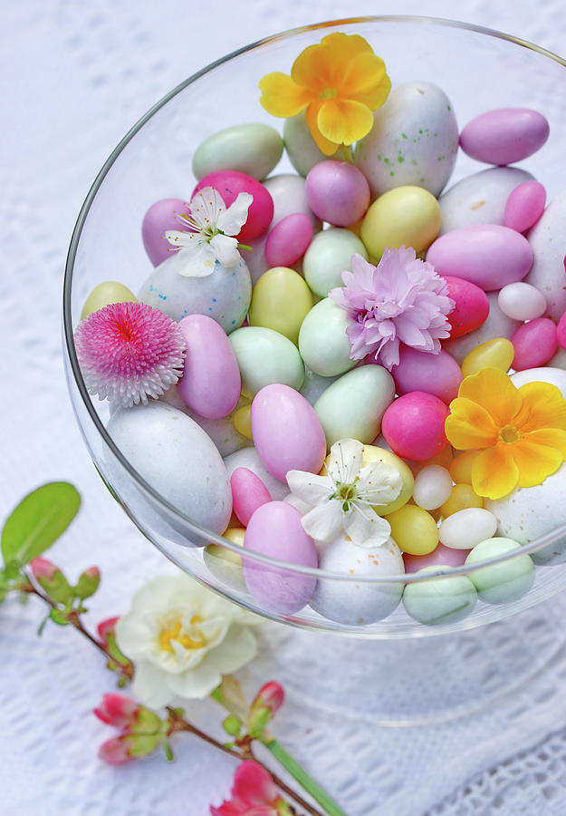 Glass Bowl With Easter Eggs And Flowers Photograph by Angelica Linnhoff