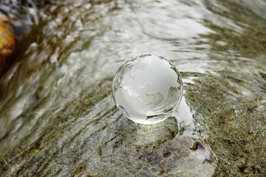 Glass Globe On The Water Stream Photograph by Sot