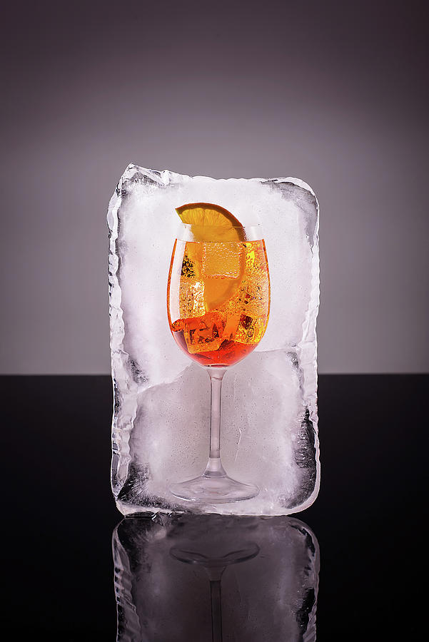 Wine Photograph - Glass Of Alcoholic Long Drink In Big Ice Cube by Cavan Images