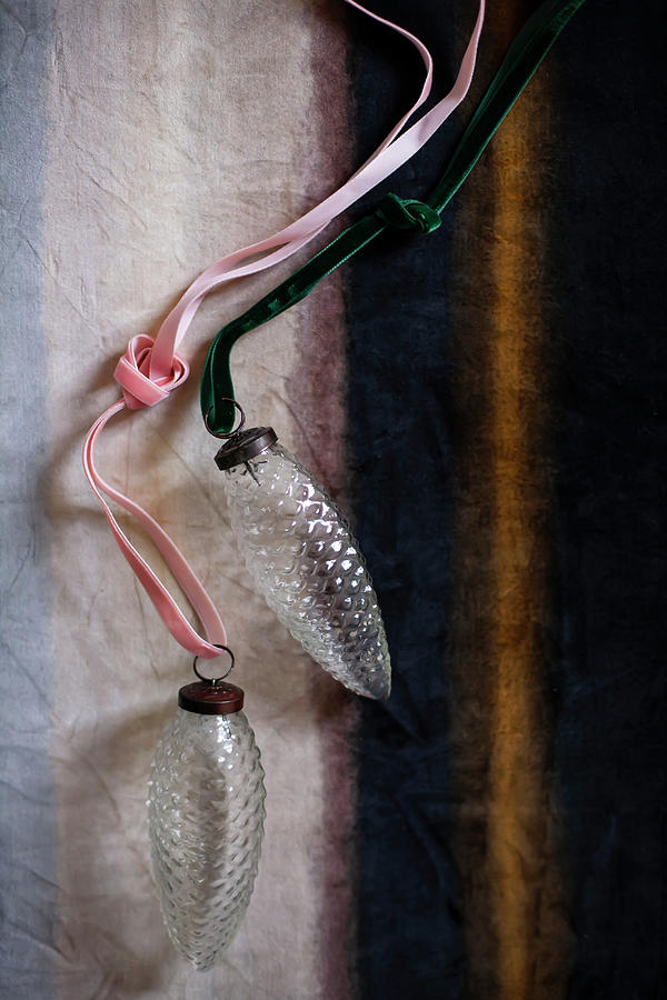 Glass, Pine-cone Christmas-tree Decorations And Ribbons Photograph by Alicja Koll