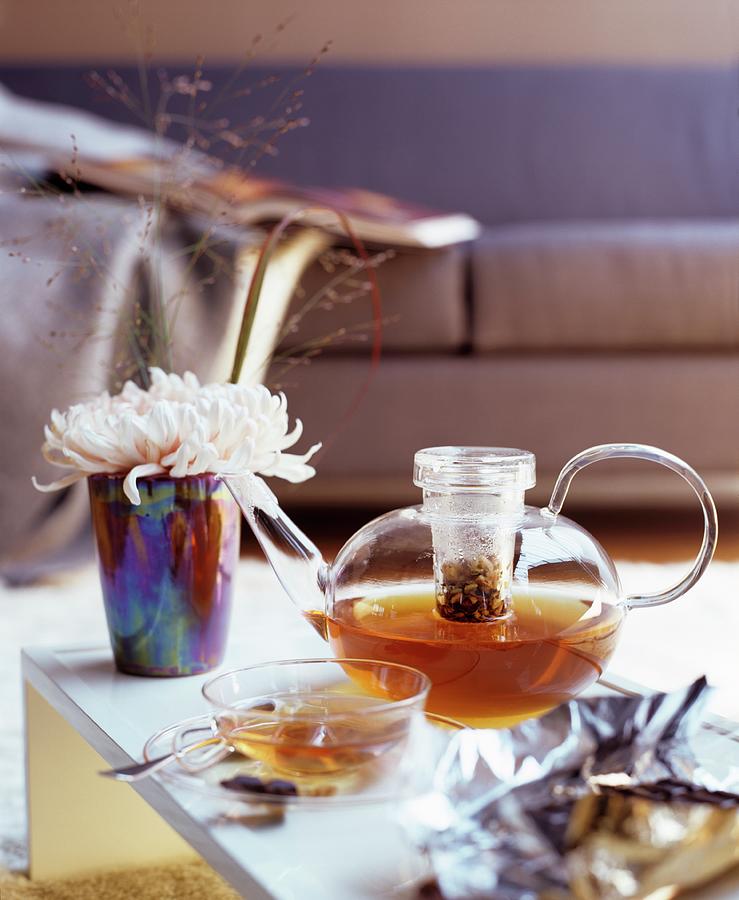 Glass Teapot And Glass Teacup On Coffee Table Photograph by Matteo Manduzio