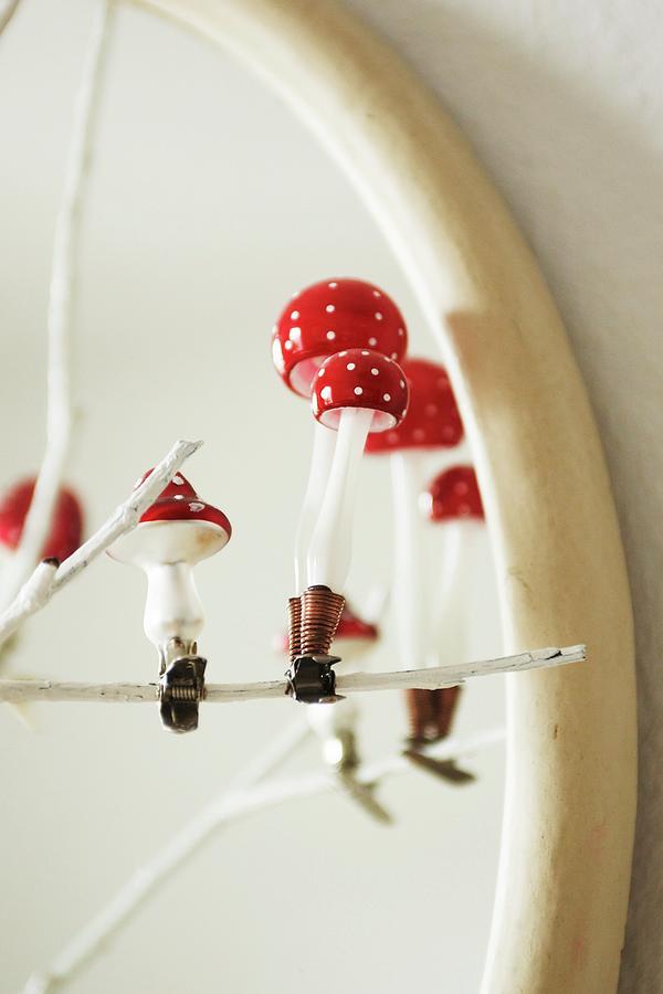 Glass Toadstools On Clips Decorating A White-painted Twig Photograph by Heidi Frhlich