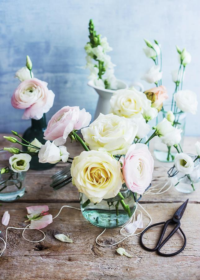 Glass Vase Of Pale Pastel Roses And Ranunculus Photograph by Ira Leoni