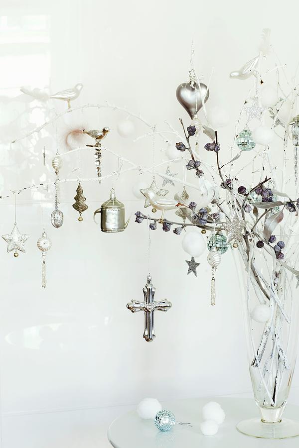 Glass Vase Of Shiny Silver Christmas Decorations Hanging From White-painted Twigs Photograph by Pics On-line / June Tuesday