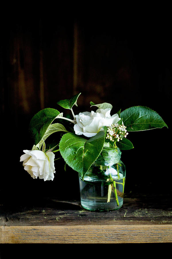 Glass Vase Of White Roses Photograph by Karen Thomas