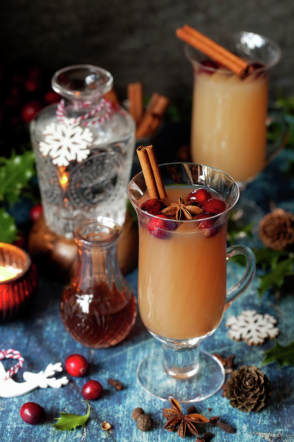 Glasses Of Mulled Gin And Tonic In A Festive Setting Photograph by Jane Saunders