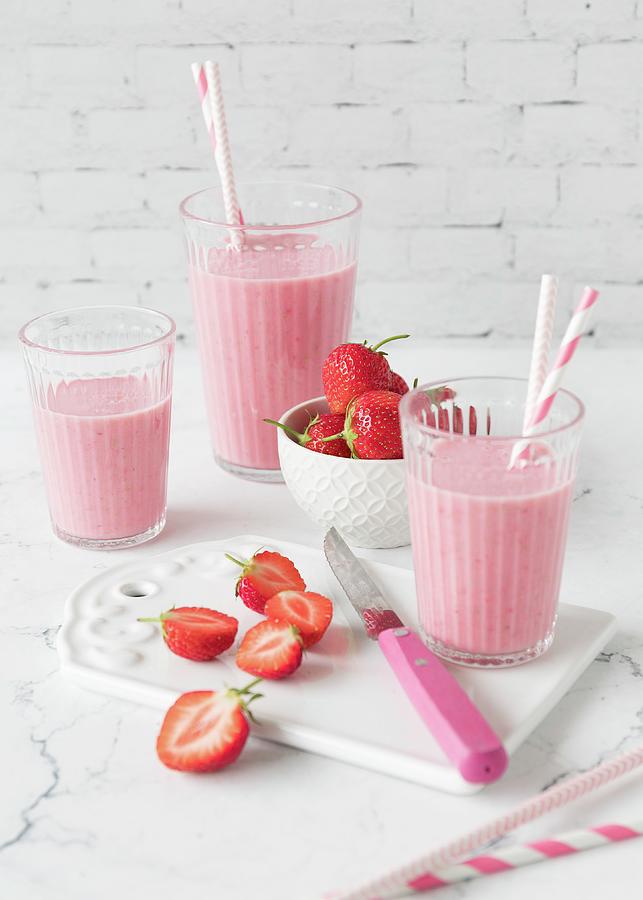 Glasses Of Strawberry Shake Photograph by Emma Friedrichs