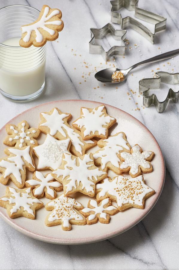 Glazed Butter Cookies, A Glass Of Milk, And Various Cookie Cutters Photograph by Ulrike Emmert