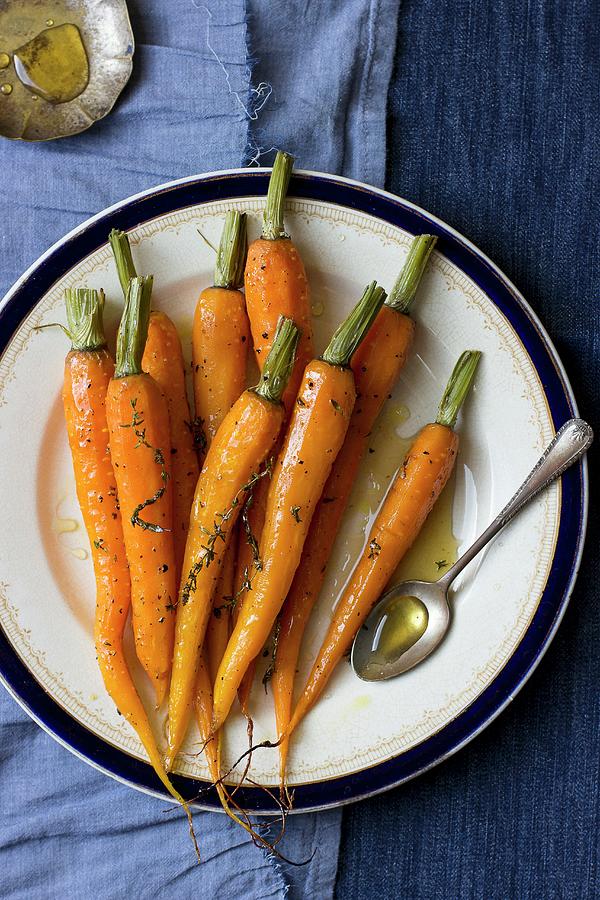 Glazed Carrots With Thyme Photograph by Zuzanna Ploch