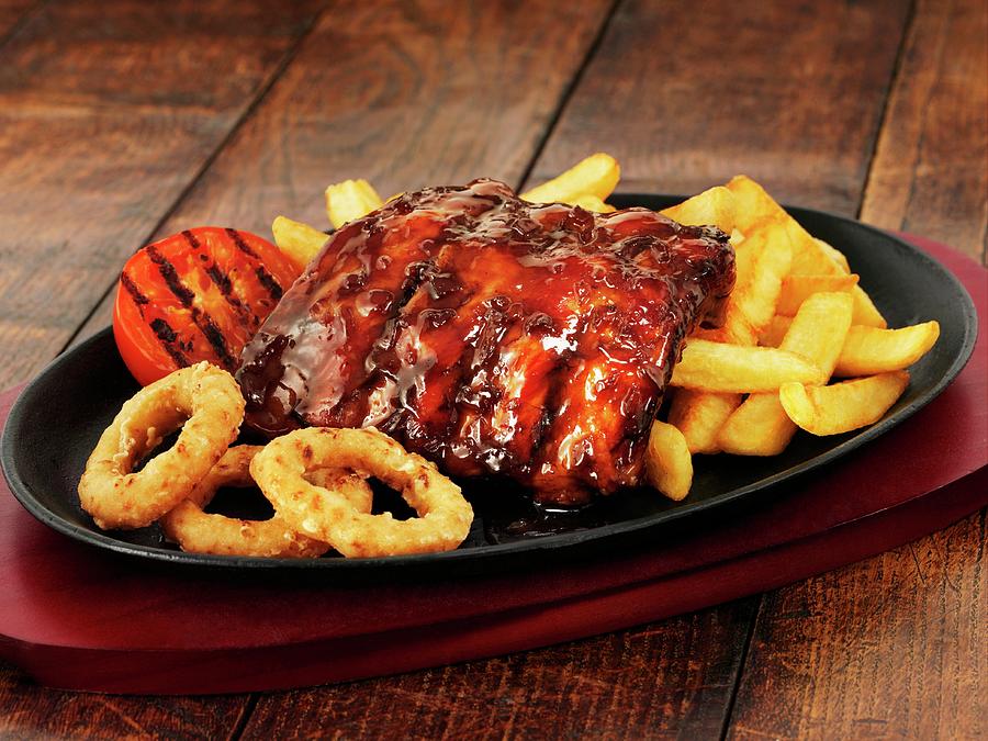 Glazed Ribs With Chips And Onion Rings Photograph by Frank Adam