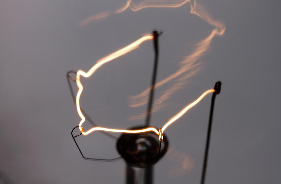 Glowing Lightbulb Filament Photograph by GIPhotoStock Images