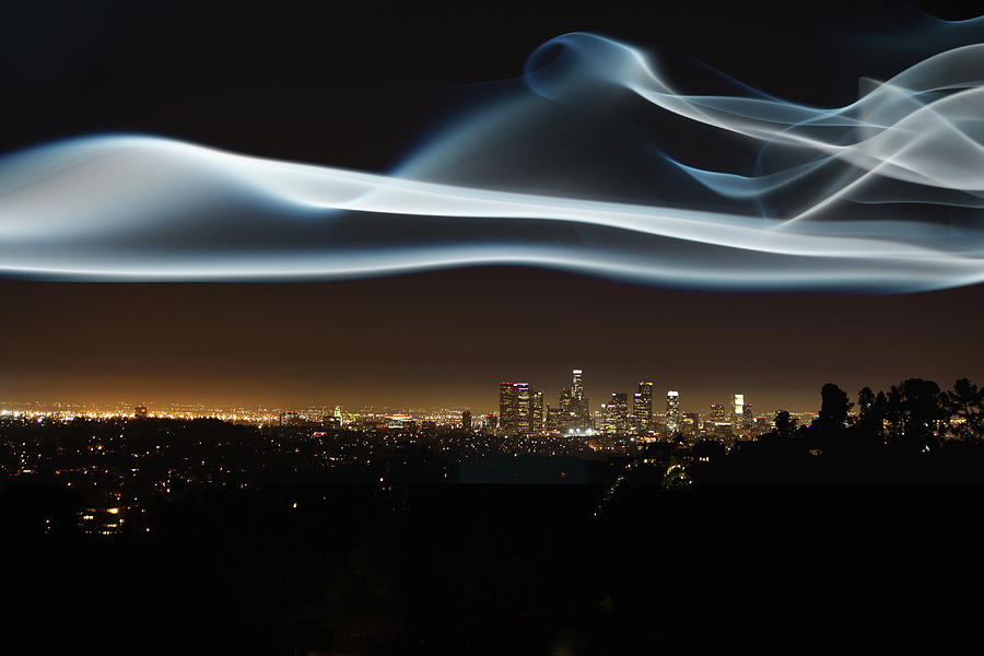 Glowing Vapor Hovering Over Cityscape Photograph by Paul Taylor