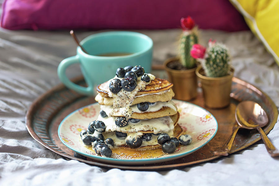 Gluten Free Banana Pancakes With Blueberries And Soy Yoghurt Photograph by Lara Jane Thorpe